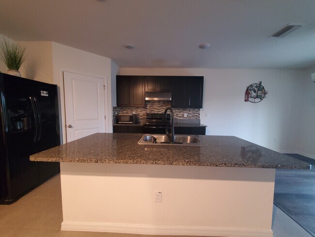 Building Photo - 6776 Wagon Trail St