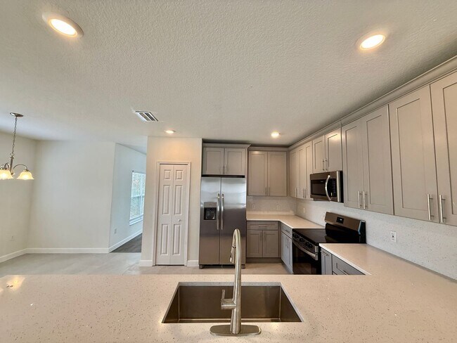 Building Photo - GORGEOUS, Large Completely Renovated Two-Story 4/2.5 PLUS LOFT in POINCIANA VILLAGES!