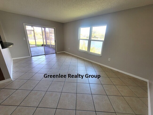 Building Photo - Relax by the water in this spacious 2-bedroom home with a 2-car garage, nestled in the highly des...