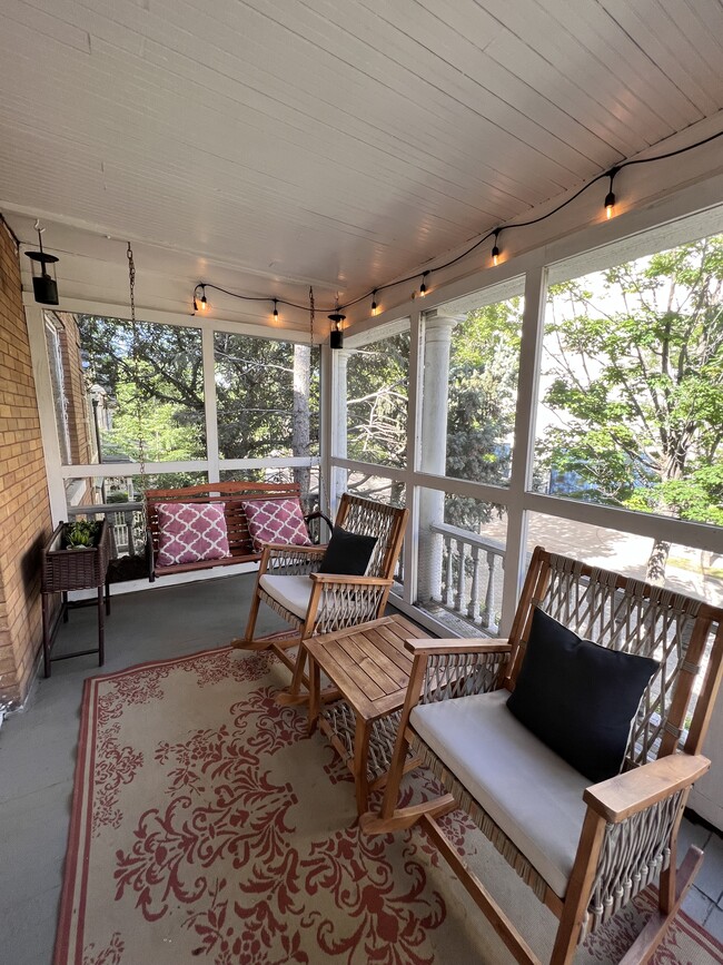 The 2nd floor front porch with views of the downtown Minneapolis skyline. - 2424 Stevens Ave