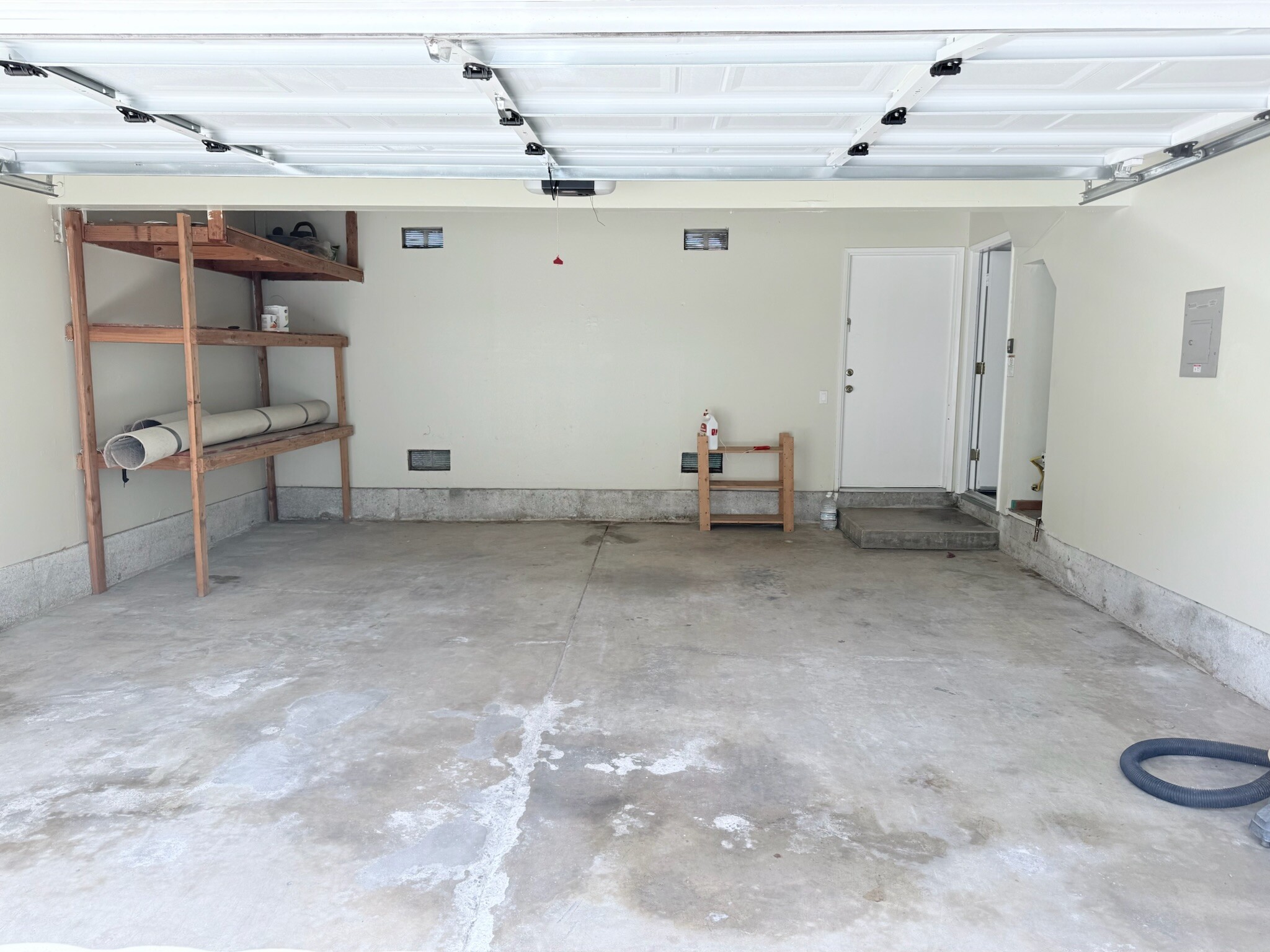 two car garage with automatic opener with battery backup. direct access to kitchen area and backyard - 631 S Glassell St
