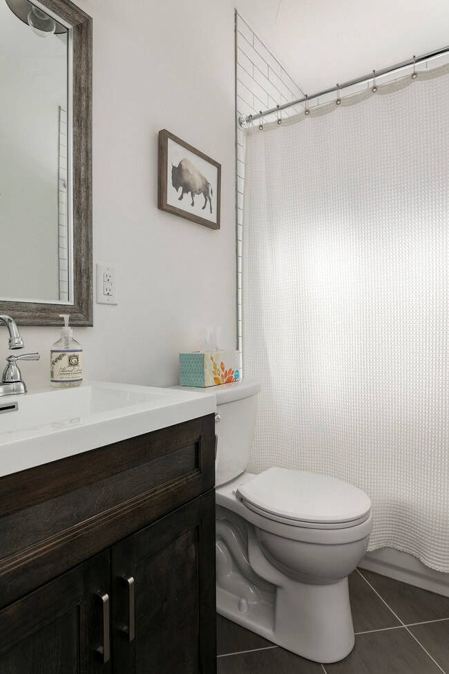 Main floor bathroom with tub. - 2117 W Jefferson St