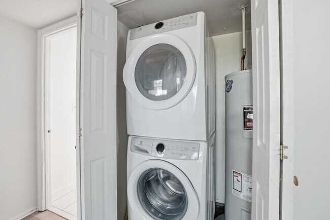 Building Photo - This expansive ground level residence is set within a serene, gated garden community surrounded b...