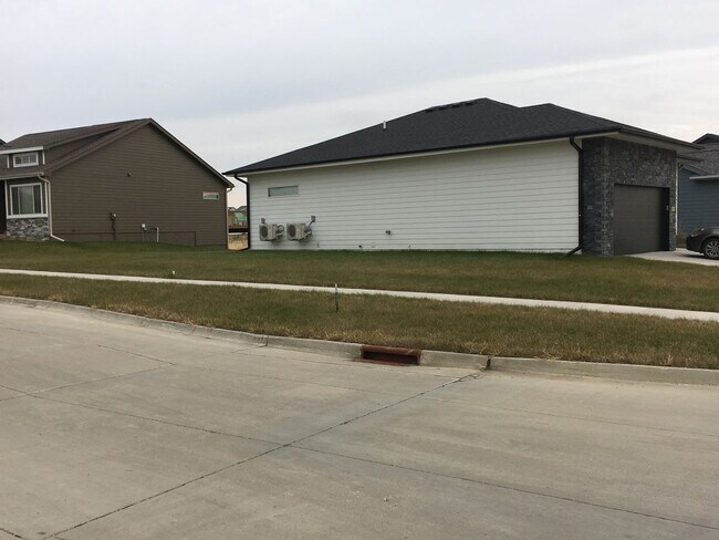 Building Photo - Spacious 4 bedroom/3 bath home with finished lower level and attached 2 car garage