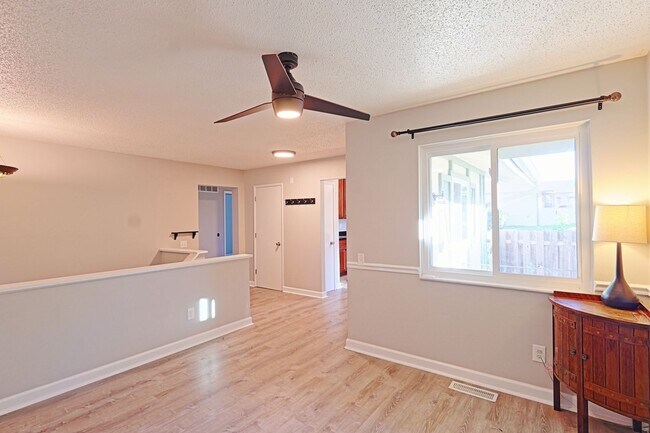 Building Photo - Spacious 3-Bedroom Condo with Finished Basement & Private Fenced Yard!