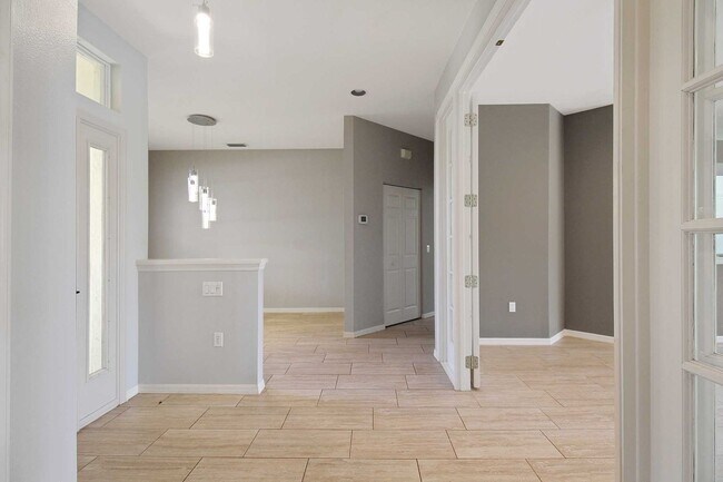 Building Photo - Annual rental: Spacious 3BR/2BA Creekwood Home with Office, Screened Lanai, EV Charger & Resort-S...