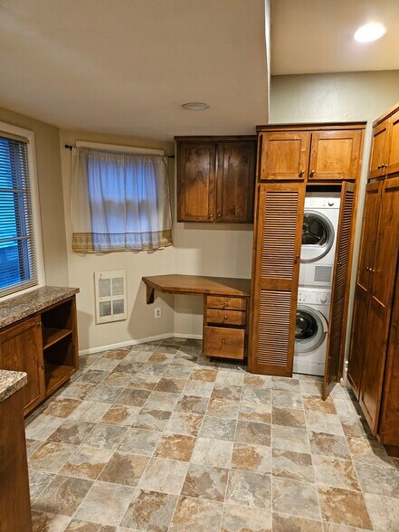 Kitchen with custom cabinets and W/D - 1207 W 7th Ave