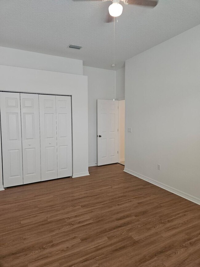 Building Photo - 4 BEDROOM 3 FULL BATH HOME WITH A SCREENED IN POOL IN THE BEAUTIFUL PALM COAST