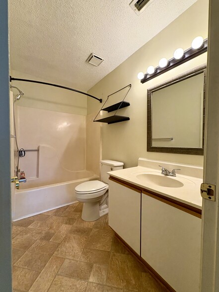 View of the master bathroom from the bedroom - 208 Quarter Trl