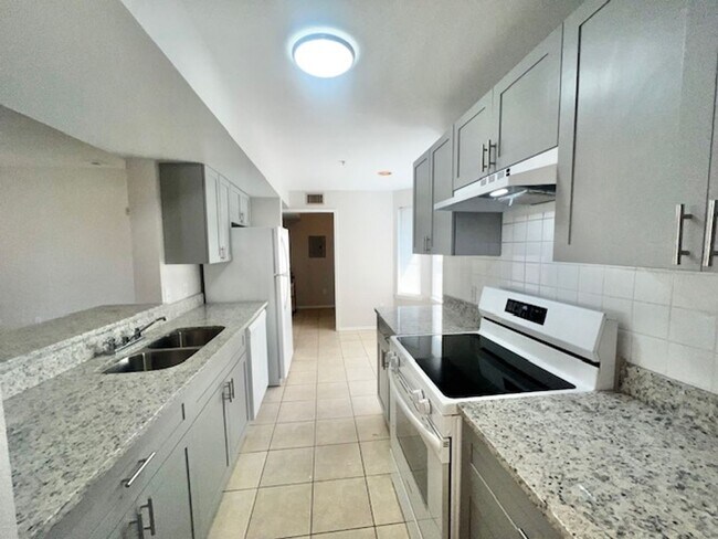 Building Photo - NEW-Remodeled bathroom & kitchen! NEW VINYL PLANK flooring & fresh paint! 2 bedroom 1 bath condo ...