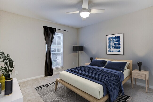 Large bedroom with brand new remote-control fan and walk-in closet. - 1880 White Oak Dr. Apt 119