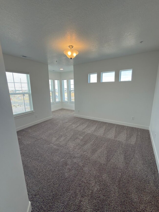 Building Photo - Brand New 3 Bed Condo with Resort-Style Amenities & Included Internet!