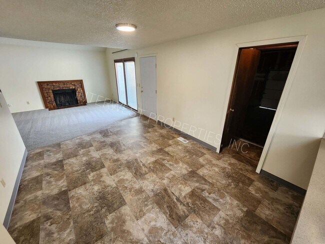 Building Photo - 3 Bd that Features Master on the Main with Fenced Yard, Fireplace, 2 Car Garage, & W/D Hookups
