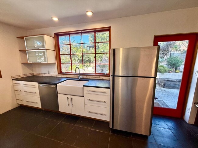 Building Photo - Hilltop Highland Park Sanctuary with Views, Private Gated Yard, In Unit Laundry, Parking & Abunda...