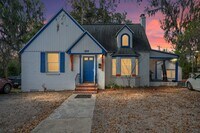 Building Photo - 6-Bedroom Home: Includes 6 parking spots!