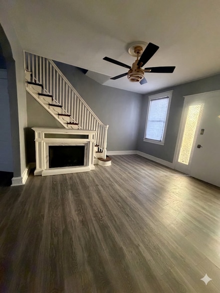 Living room with heater fire place and ceiling Tv mount able to hold up to 100” - 4744 Sheffield Ave