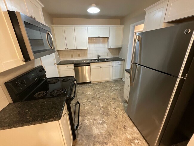 Building Photo - Reduced to $1550/mo! N Central Greensboro location, 3/2 brick home with lots of shade, fresh paint!