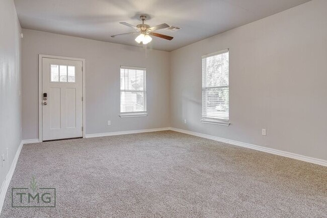 Building Photo - Spacious 3/2 with Front Porch, Fenced Yard...