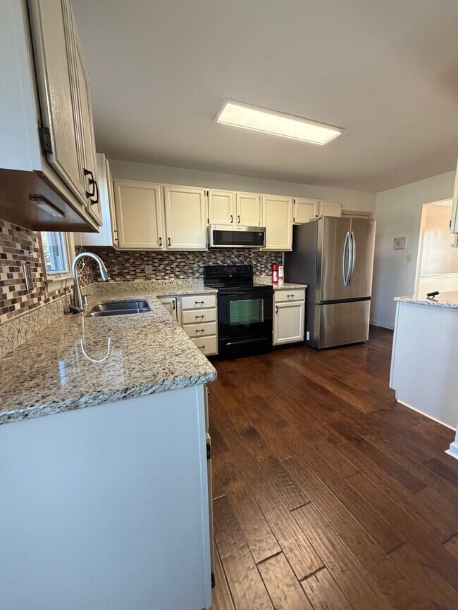 Building Photo - 4 Bedrooms with Finished Basement and Bonus Room!