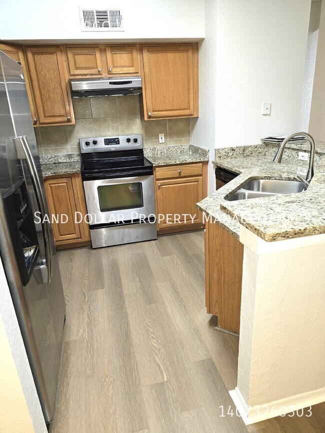 Building Photo - Wonderfully renovated 2nd floor condo in a...