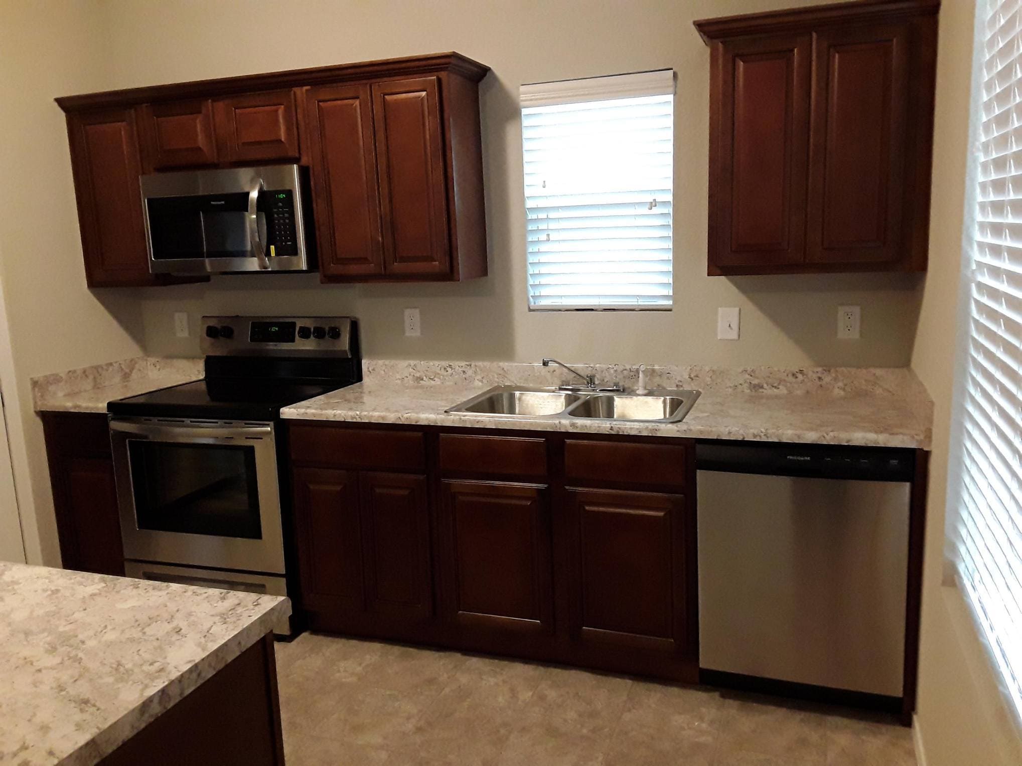 Roomy kitchen with stainless steel appliances. - 5074 W Claxton Circle