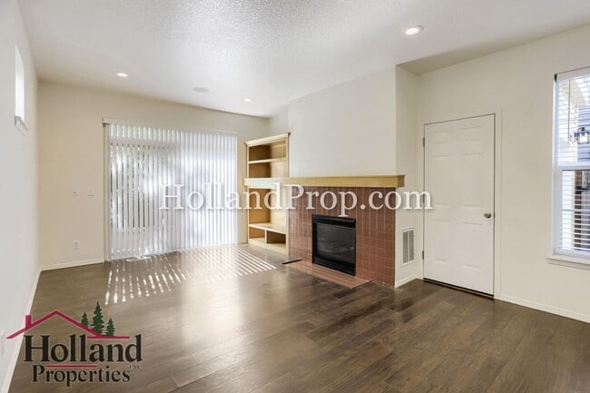 Building Photo - Charming 3-Bedroom Home with Wood Floors, Gas Fireplace & Private Patio