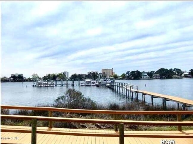 Building Photo - WATERFRONT W/BOAT SLIP!!!! This beautiful home is located in a gated community on North Lagoon Dr...