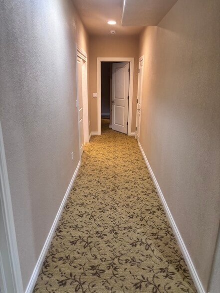 Hallway to bedrooms and hall closet/storage - 502 Stardance Way