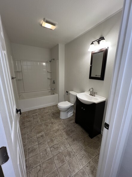 Bathroom with newer vanity, medicine cabinet and lights - 620 6th Ave