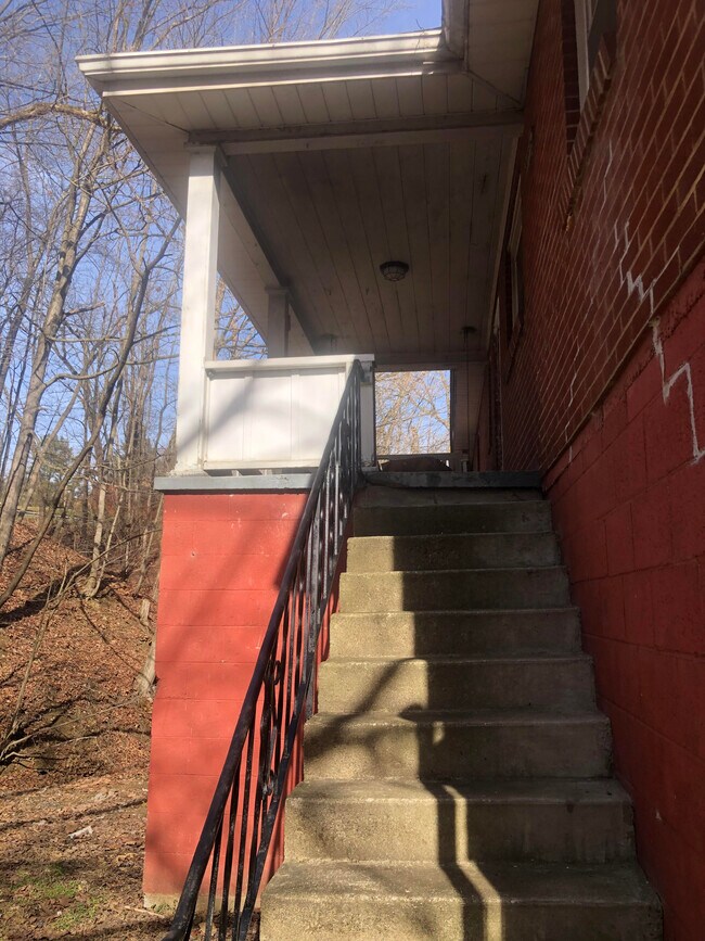 Covered Back Porch where you can listen to the sounds of the Creek - 507 N 12th St