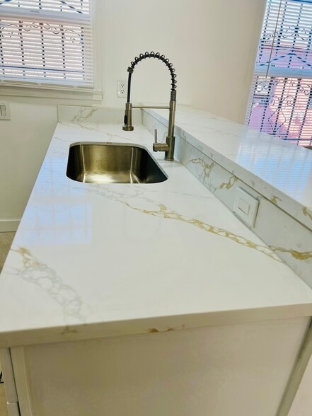 Beautifully remodeled kitchen with new appliances, microwave, marble countertops, pull-down sprayer - 3551 W Manchester Blvd