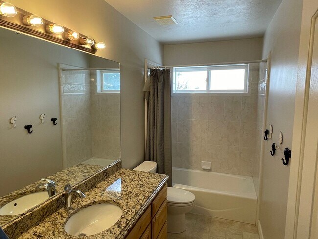 Building Photo - Beautiful home with 3 car garage and oversized covered deck.