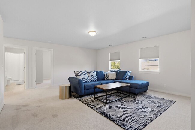 Building Photo - Stunner! This beautiful home features a spacious open floor plan with primary suite and private o...