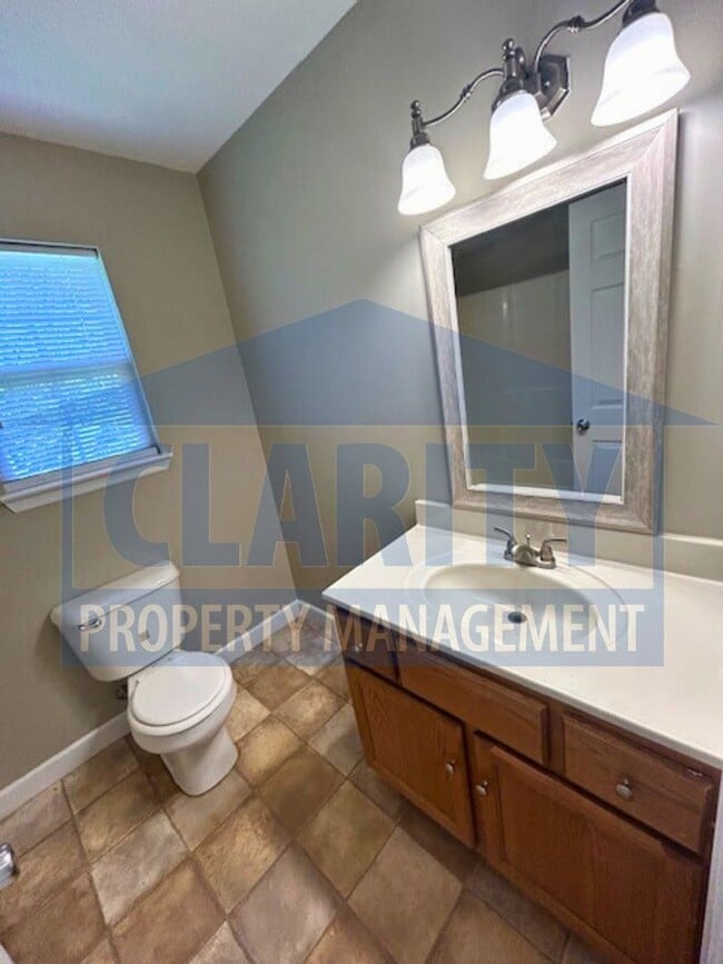 Building Photo - Charming three-bedroom home with carport!