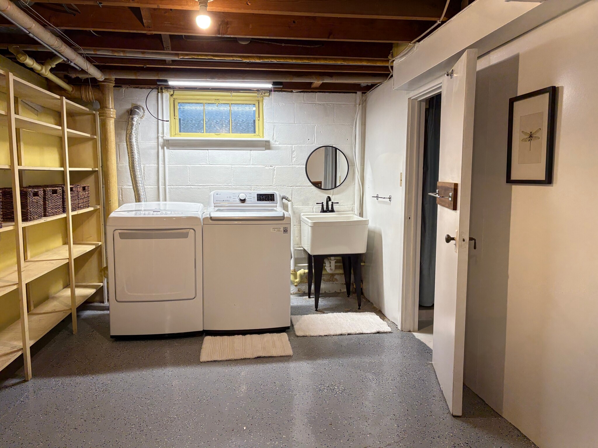 Laundry room includes additional storage, wash tub and third half bath. - 4112 Gladstone St