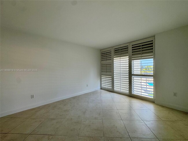 Building Photo - 10275 Collins Ave