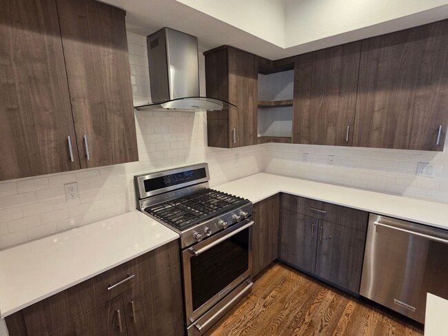 Building Photo - STUNNING 4-LEVEL TOWNHOME IN HIGHLANDS WITH SAUNA, 2-CAR GARAGE + AMAZING ROOFTOP DECK!