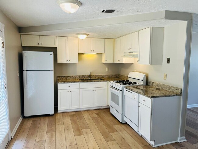 Building Photo - Wow! Check out this charming 4-bedroom, 1-...