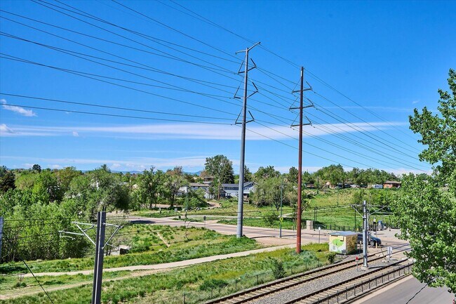 Building Photo - Modern 4-Bedroom Townhome with Rooftop Deck Near Sloan’s Lake & Light Rail