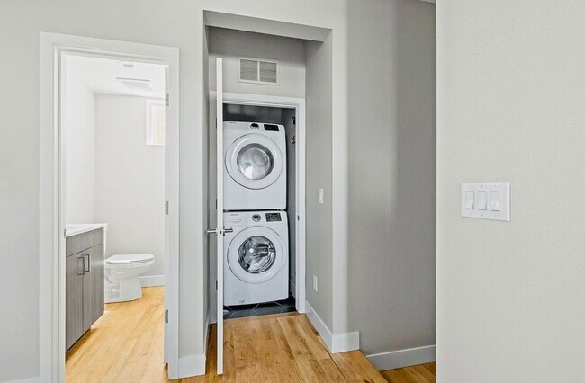Explore the practicality of a thoughtfully designed laundry space in this contemporary home. - Harley House