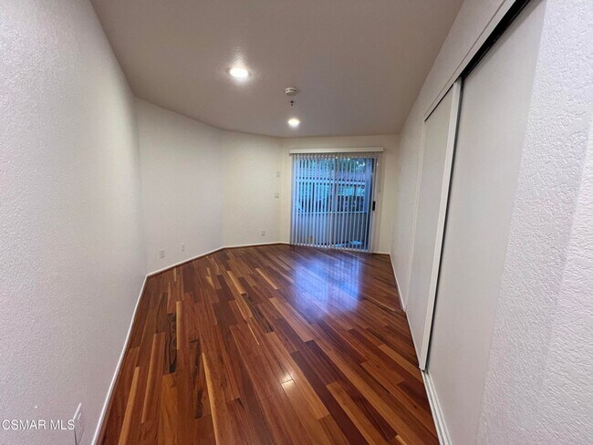 Building Photo - Welcome to this beautifully situated first-floor end unit