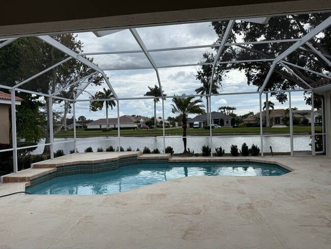 Building Photo - Luxurious 4 Bedroom 3 Bath Lakefront Pool Home W/3-Car Garage