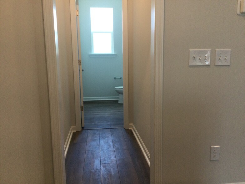2nd floor hall leading into 1/2 bathroom - 208 Hickory Plains Rd