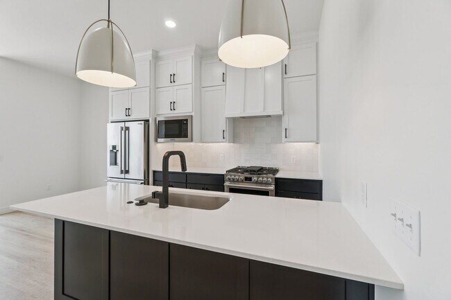 Building Photo - Bright. Clean. Calm. Your Elevated One-Bed...