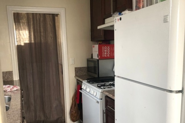 Kitchen leads to laundry room - 1678 S Longwood Ave