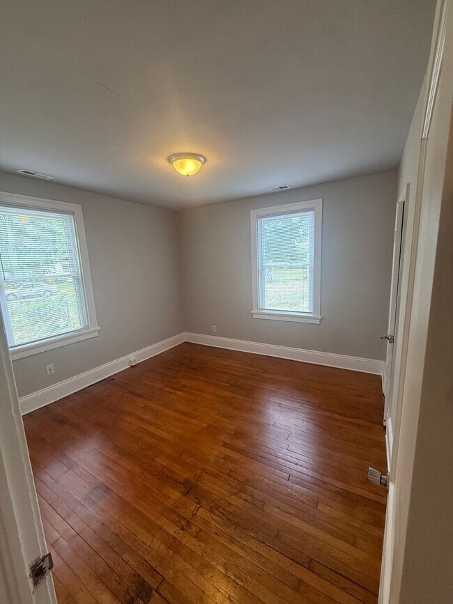 Building Photo - 2-bedroom 1 bathroom Cottage on a large lot with 2 large storage building on site