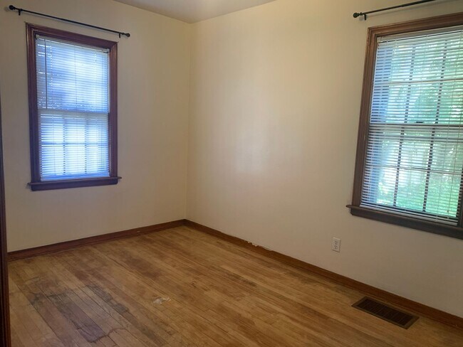 Building Photo - Three bedroom home with beautiful hardwood floors and central air!