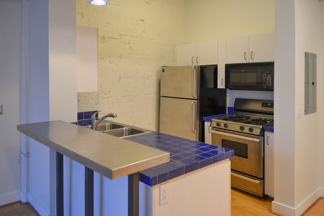 Building Photo - North Park Lofts - Historic Pearl District Warehouse Studio w/parking/most utilities/rooftop patio