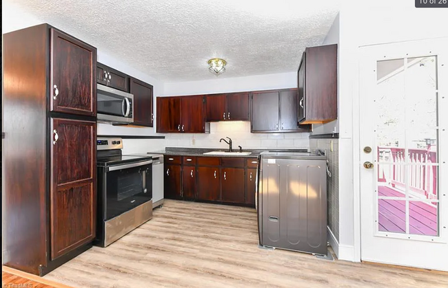 Stainless steel and dark wood kitchen - 121 Park Dr