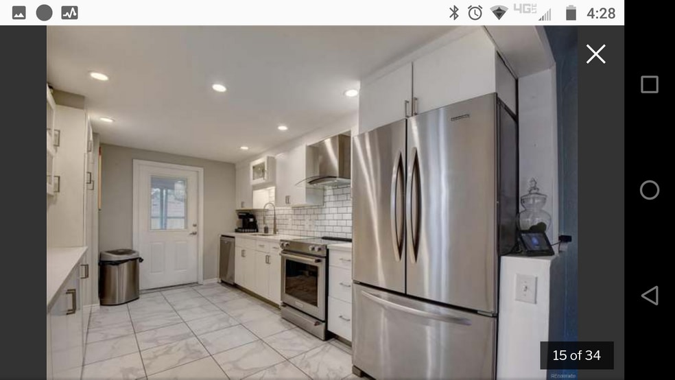 Updated Kitchen with gleaming stainless steel appliances. - 1808A Simms St